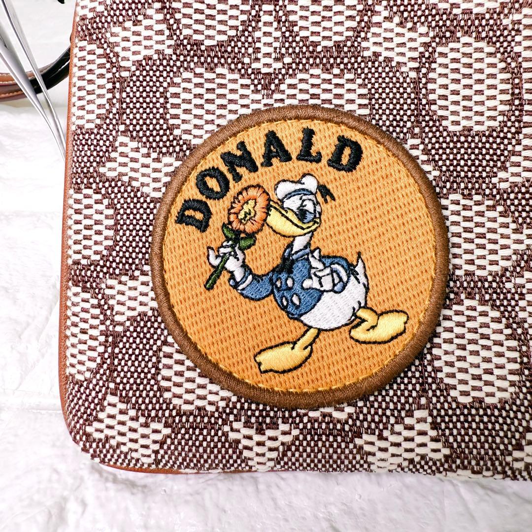 タグ付【未使用】COACH ポーチ シグネチャー ディズニー ドナルド デイジー